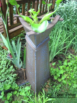 Water plant container by Larry W. Elardo